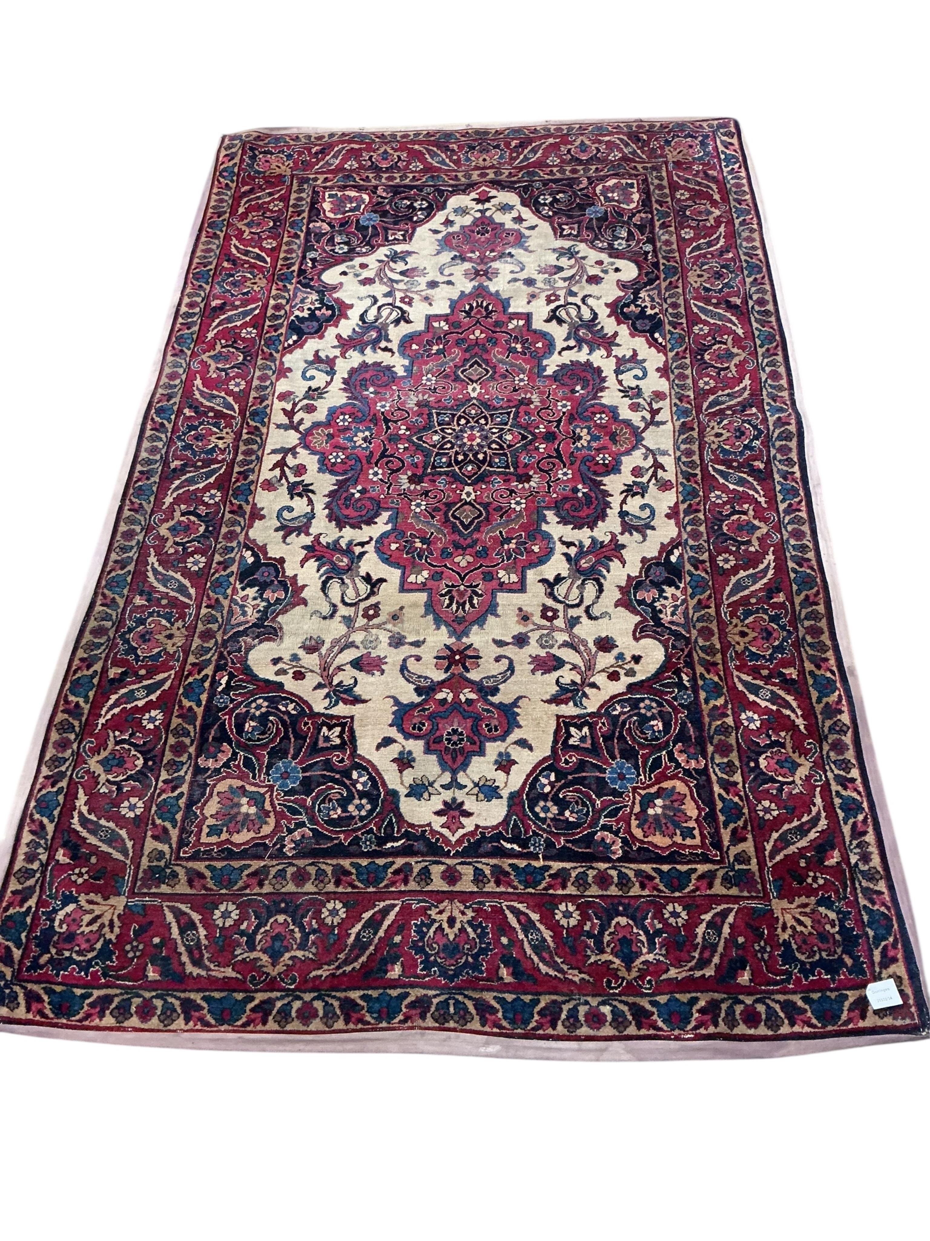 A Tabriz ivory ground rug, 208 x 125cm